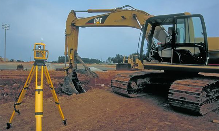 Spectra Laser with Cat Excavator on Jobsite