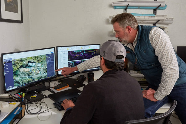Trimble Works Manager on Computer Screens in Office