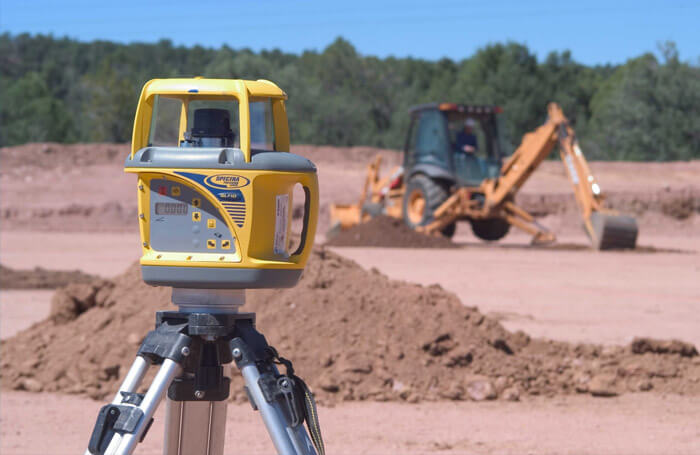 Spectra Laser Jobsite with Heavy Equipment in the Background